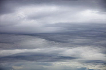 Patterns in cloud on an occluded front over the Lake District hills in Ambleside, Cumbria, England, United Kingdom, Europe