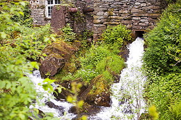 A hydro electric turbine producing green electricity in the grounds of Rydal Hall near Ambleside, Lake District, Cumbria, England, United Kingdom, Europe