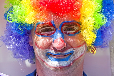 A man dressed up as a clown, Ilfracombe, Devon, England, United Kingdom, Europe