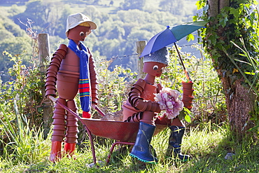 Plantpot men in Berrynarbor village in north Devon, England, United Kingdom, Europe