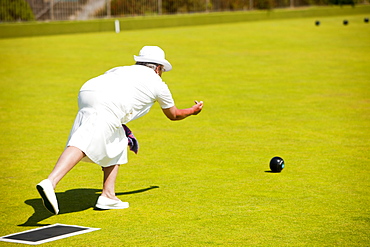 Woman playing bowls at Penzance in West Cornwall, England, United Kingdom, Europe