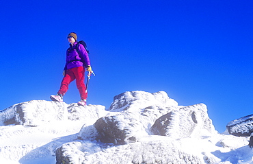 A woman mountaineer on Crinkle Crags in the Lake District, Cumbria, England, United Kingdom, Europe