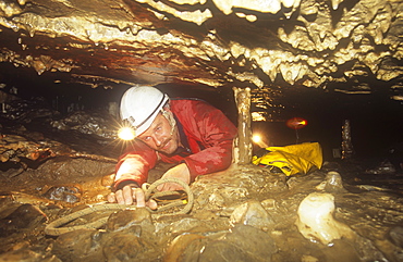 A caver in Easegill Caverns in the Yorkshire Dales, Yorkshire, England, United Kingdom, Europe