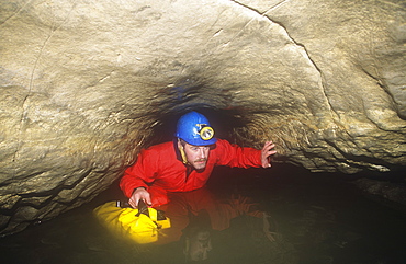 A caver in Kingsdale master cave, Yorkshire Dales, Yorkshire, England, United Kingdom, Europe