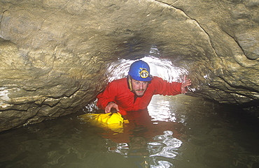 A caver in Kingsdale master cave, Yorkshire Dales, Yorkshire, England, United Kingdom, Europe