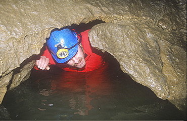 A caver in Kingsdale master cave, Yorkshire Dales, Yorkshire, England, United Kingdom, Europe