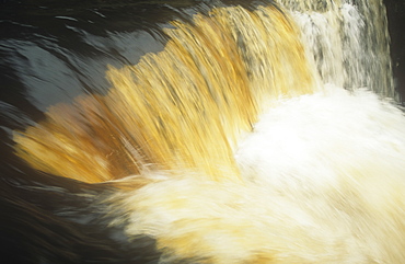 Water stained with peat in Swaledale, Yorkshire Dales, Yorkshire, England, United Kingdom, Europe