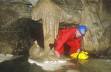 A caver in Kingsdale master cave, Yorkshire Dales, Yorkshire, England, United Kingdom, Europe