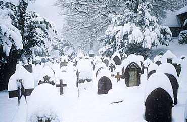 Heavy snowfall in Ambleside churchyard, Lake District, Cumbria, England, United Kingdom, Europe