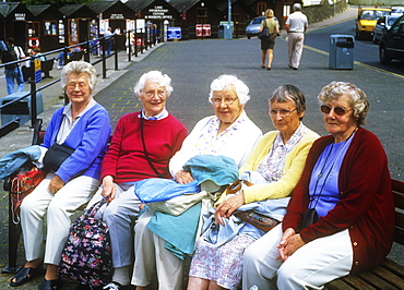 Old women on a bench in Bowness on Windermere, Lake District, Cumbria, England, United Kingdom, Europe