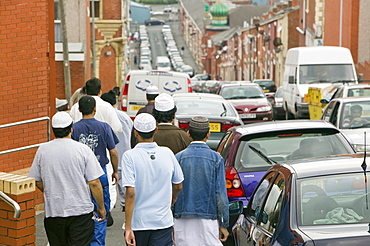 Muslims off to Friday prayers in the Asian area of Blackburn, Lancashire, England, United Kingdom, Europe