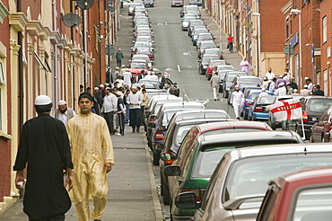 Muslims off to Friday prayers in the Asian area of Blackburn, Lancashire, England, United Kingdom, Europe