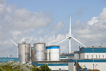 Wind turbines producing renewable electricity in the grounds of the Iggesund paperboard manufacturer on the outskirts of Workington, Cumbria, England, United Kingdom, Europe