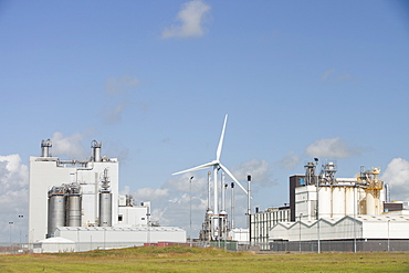 A 2 MW wind turbine producing renewable electricity in the grounds of the Eastman factory on the outskirts of Workington, Cumbria, England, United Kingdom, Europe