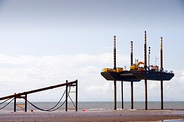 A jack up barge laying the onshore electricity cable from the offshore wind farm, Robin Rigg, in the Solway Firth, north of Workington, Cumbria, England, United Kingdom, Europe