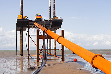 A jack up barge laying the onshore electricity cable from the offshore wind farm, Robin Rigg, in the Solway Firth, north of Workington, Cumbria, England, United Kingdom, Europe