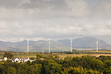 Wind turbines on the outskirts of Workington, with the Lake District hills beyond, Cumbria, England, United Kingdom, Europe