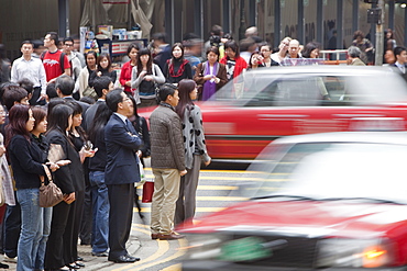 Crowds of people on the street in Hong Kong, China, Asia