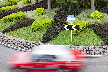 Taxi going round a roundabout in Hong Kong, China, Asia