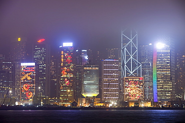 Office blocks lit up at night in Hong Kong, China, Asia