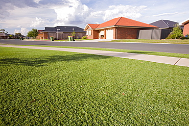 New houses designed with plastic grass lawns as it is too expensive to water lawns, or water restrictions don't allow lawn watering, Echuca, Victoria, Australia, Pacific