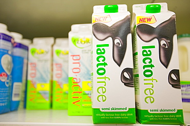 Lactose free milk for sale on supermarket shelves, Cumbria, England, United Kingdom, Europe