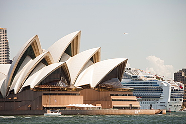 Sydney Opera House, UNESCO World Heritage Site, with a large cruise liner docked in Sydney Harbour, Sydney, New South Wales, Australia, Pacific