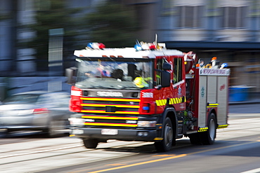 A Melbourne fire engine responding to an emergency in the city centre, Melbourne, Victoria, Australia, Pacific