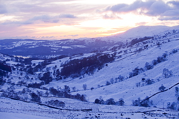 Sunset from the side of Wansfell in winter, above Ambleside, Lake District, Cumbria, England, United Kingdom, Europe