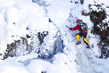 The mountaineer, Mike Withers, ice climbing in Fisher Place gill above Thilrmere in the Lake District, Cumbria, England, United Kingdom, Europe