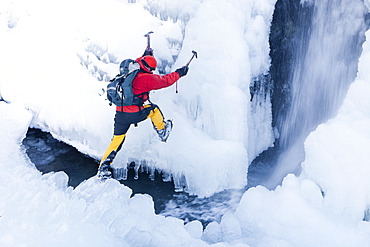 The mountaineer, Mike Withers, ice climbing in Fisher Place gill above Thilrmere in the Lake District, Cumbria, England, United Kingdom, Europe