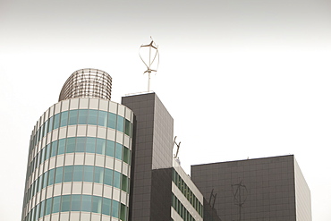 An urban wind turbine on the roof of The Peninsula, a new office development in Manchester, England, United Kingdom, Europe