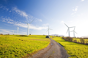 A wind farm on the outskirts of the Lake District with Skiddaw behind, Cumbria, England, United Kingdom, Europe