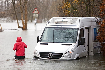 A van washed away on a flooded road near Ambleside, Lake District, Cumbria, England, United Kingdom, Europe