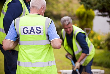 Workers from British Gas replacing old metal gas pipes with plastic piping in Ambleside, Cumbria, England, United Kingdom, Europe