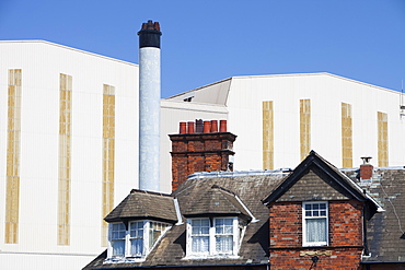 BAE systems buildings overshadowing old terraced houses in Barrow in Furness, Cumbria, England, United Kingdom, Europe