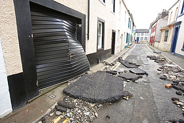 Tarmac ripped up by the power of the flood water in November 2009, Cockermouth, Cumbria, England, United Kingdom, Europe