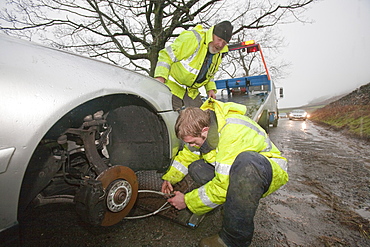 Car abandoned in the flood waters on Kirkstone Pass that subsequently had all its wheels stolen, above Ambleside, Cumbria, England, United Kingdom, Europe