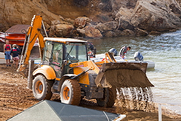 Repairing storm damage by adding new sand to a beach in Teos, Western Turkey, Eurasia