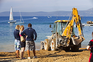 Repairing storm damage by adding new sand to a beach in Teos, Western Turkey, Eurasia