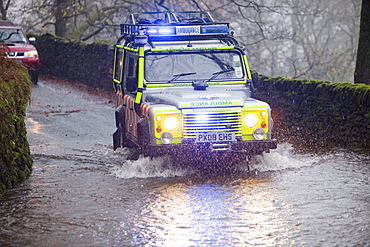 A Langdale Ambleside Mountain Rescue Team responding to calls for help from flooded motorists, Ambleside, Lake District, Cumbria, England, United Kingdom, Europe