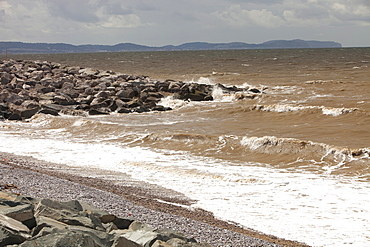 Rocks placed to re-inforce the sea wall in the area of the North Wales coast between Prestatyn and Abergele which was reclaimed from an ancient salt marsh, and is flat, low lying and susceptible to coastal flooding, Wales, United Kingdom, Europe