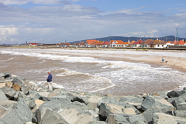 Rocks placed to re-inforce the sea wall in the area of the North Wales coast between Prestatyn and Abergele which was reclaimed from an ancient salt marsh, and is flat, low lying and susceptible to coastal flooding, Wales, United Kingdom, Europe