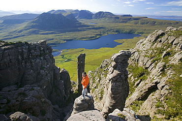 A climber on Stac Pollaidh in Assynt, Sutherland, Scotland, United Kingdom, Europe