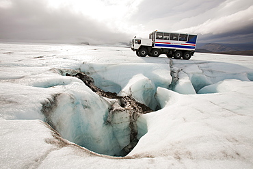 A twenty ton ice explorer truck owned and run by Arngrimur Hermannsson (Arni), taking tourists onto the Langjokull ice cap, Iceland, Polar Regions