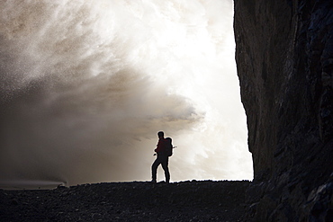 Mountaineer by the overspill from the Karahnjukar dam and Halslon reservoir, North East Iceland, Iceland, Polar Regions