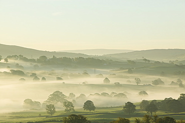 Morning mist over the Kent Valley near Kendal Cumbria UK