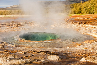 A Geysir a split second before its eruption at Geysir in Iceland, Polar Regions