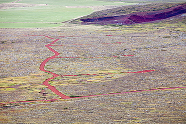 Scoria depsoits quarried from the Seydisholar scoria volcanic cone being used for road stone to create a network of tracks for new holiday cabins near Selfoss in Iceland, Polar Regions