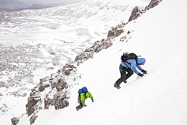 Mountaineers descending the Goat track on the Cairngorm plateau, above Corie an Sneachda, Cairngorm mountains, Scotland, United Kingdom, Europe